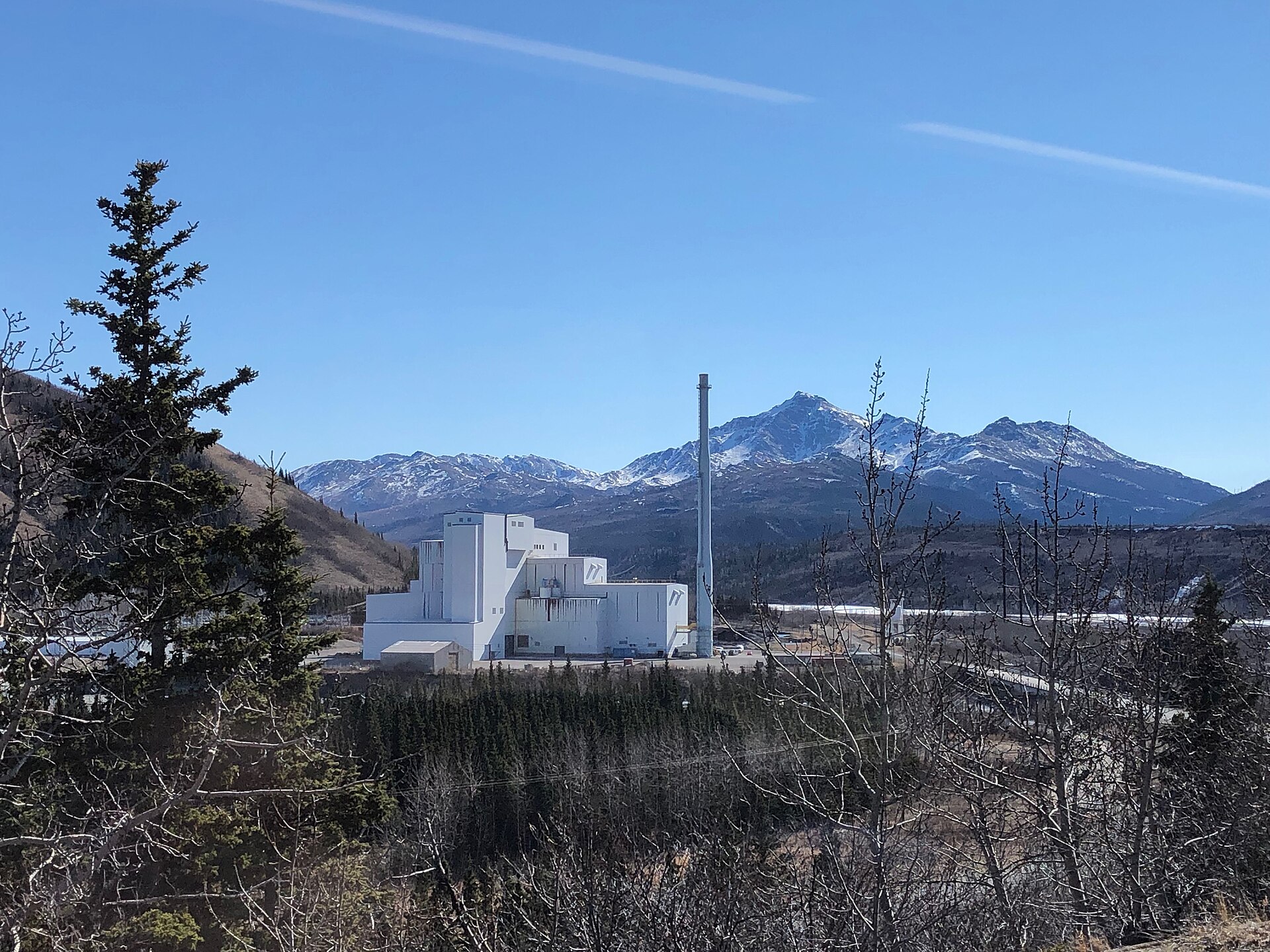 Photo of the GVEA Healy Power Plant and its stack below snowy Alaska Range peaks, a key power source for Fairbanks and North Pole, Alaska